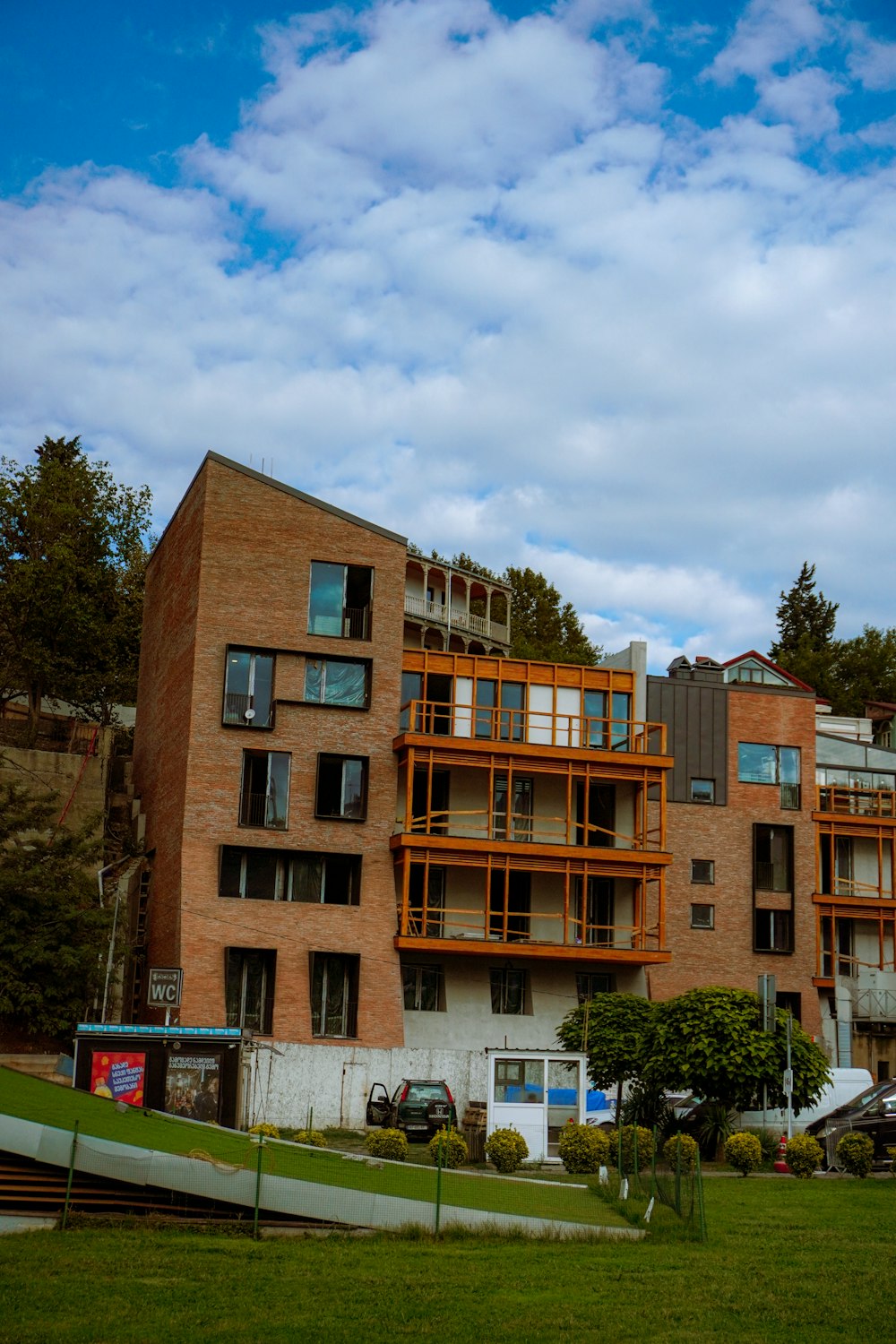 a large brick building with balconies and balconies on top