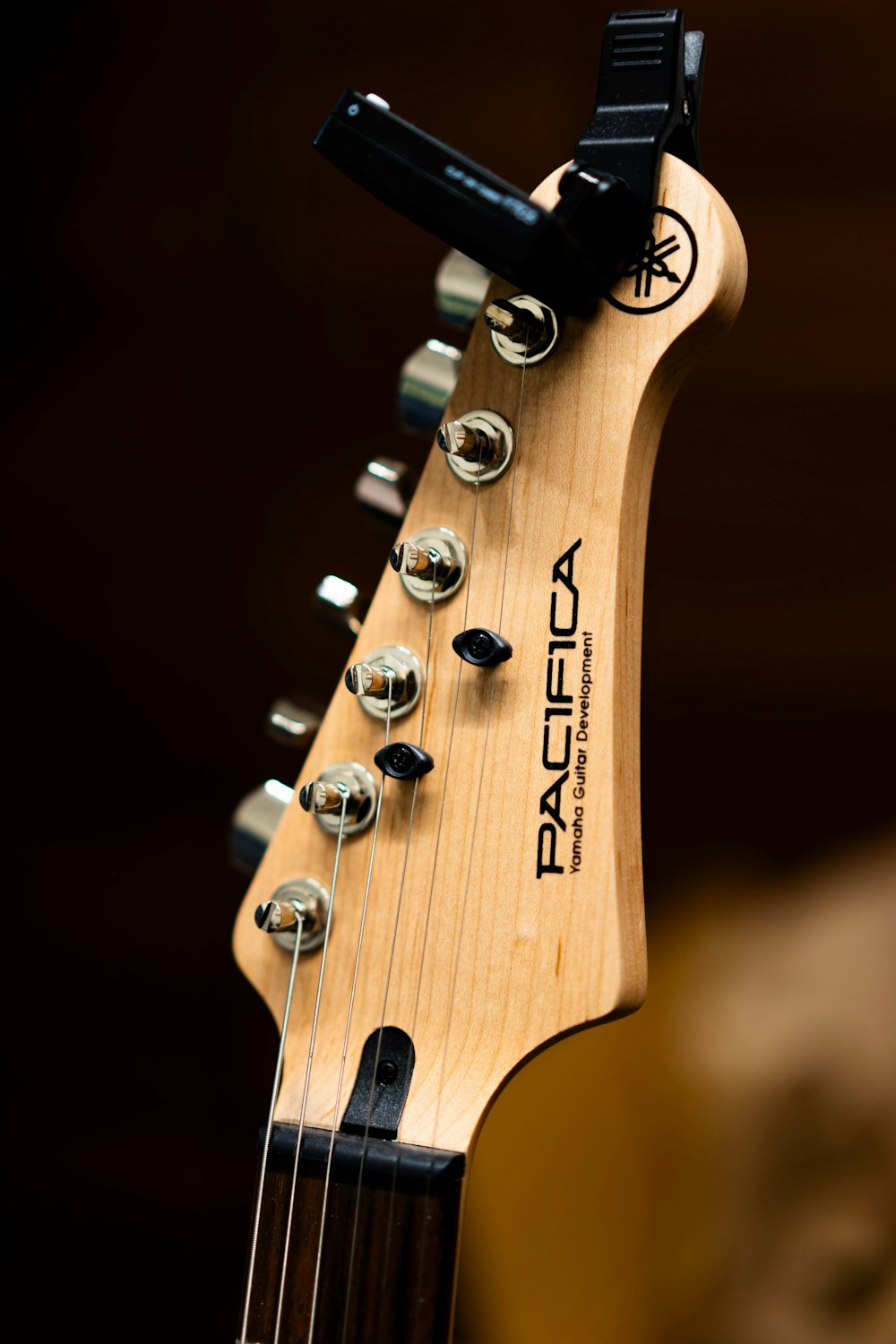 a close up of a wooden guitar neck