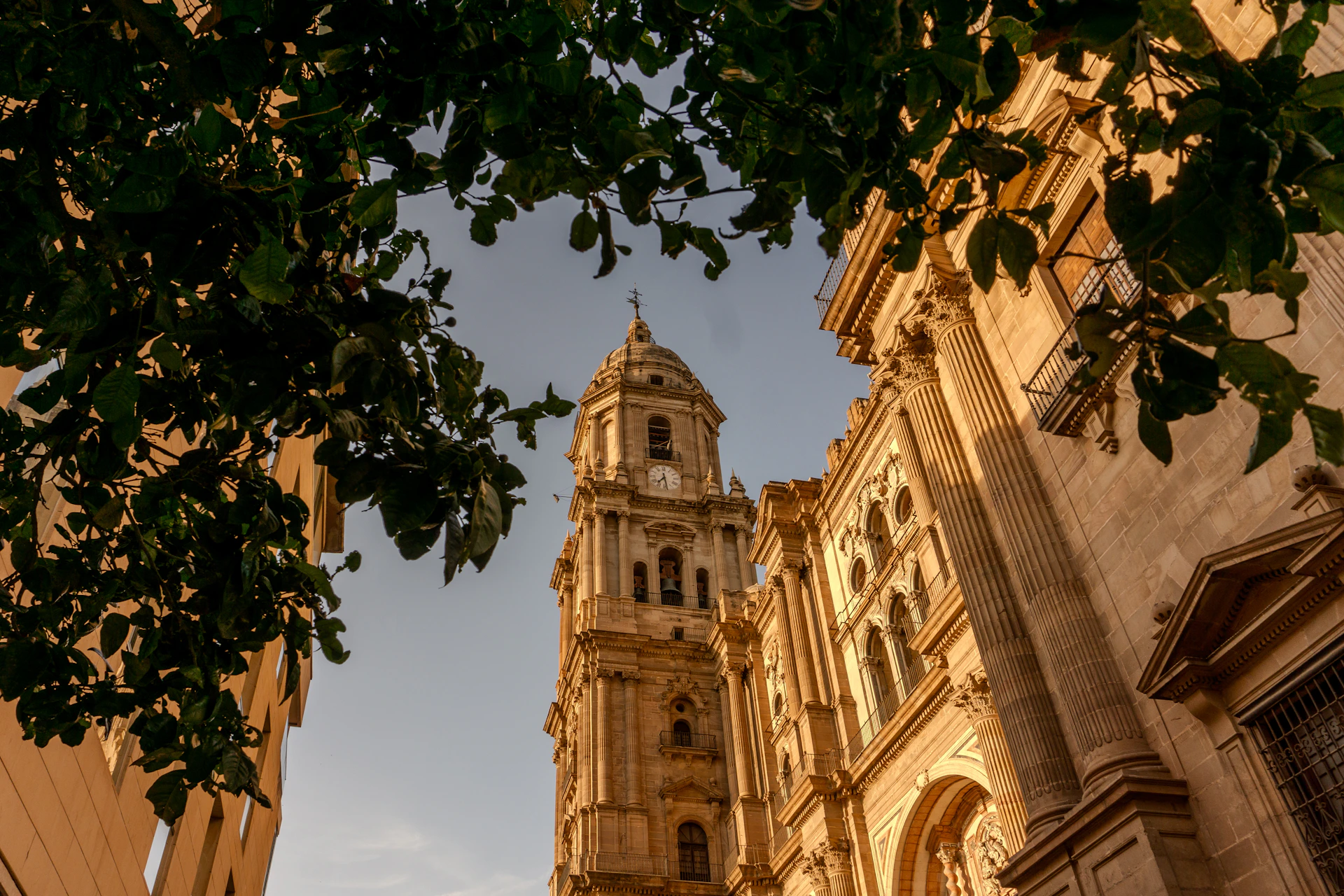 a tall clock tower towering over a city