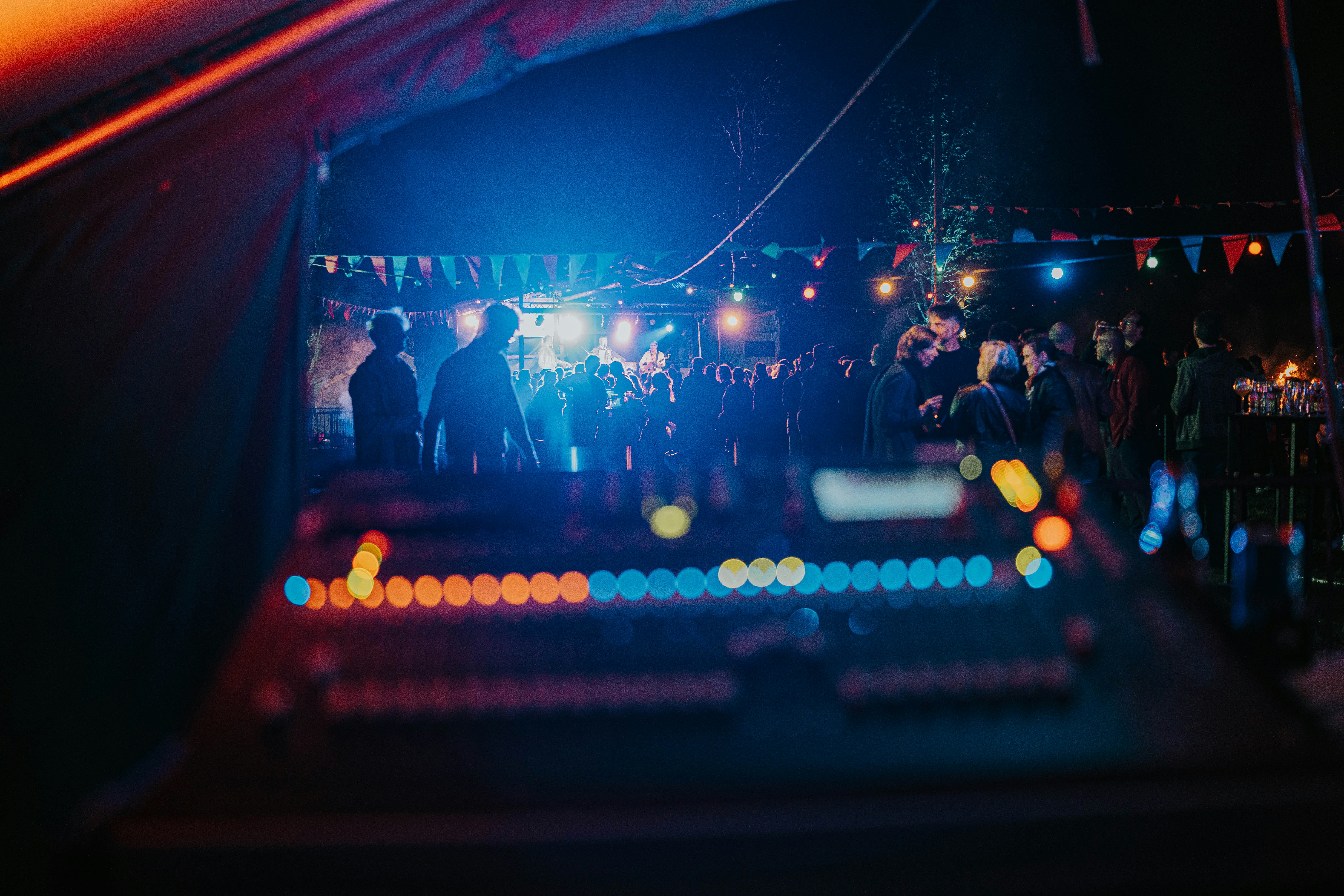 a group of people standing around at a party