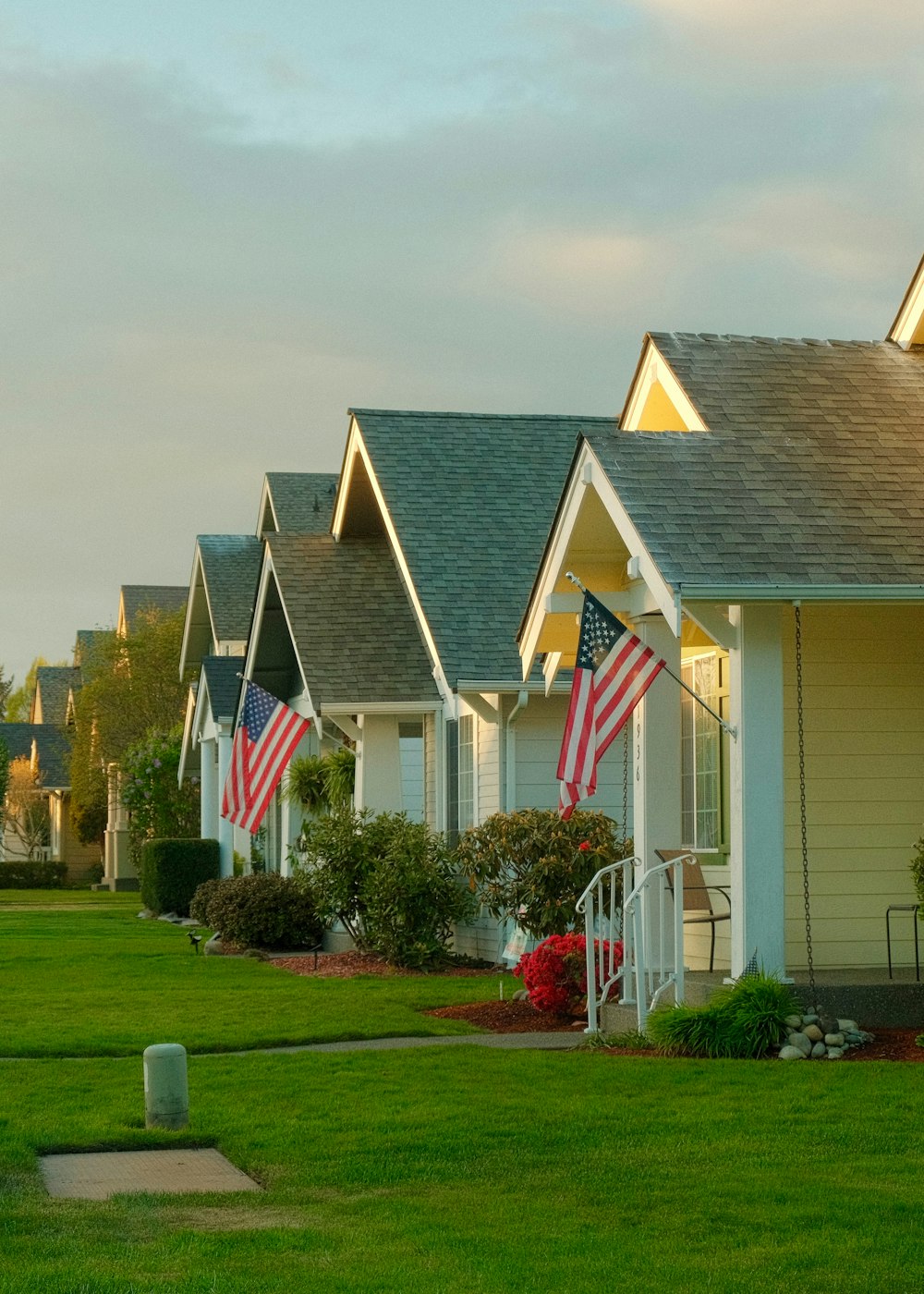 a row of houses with american flags on them