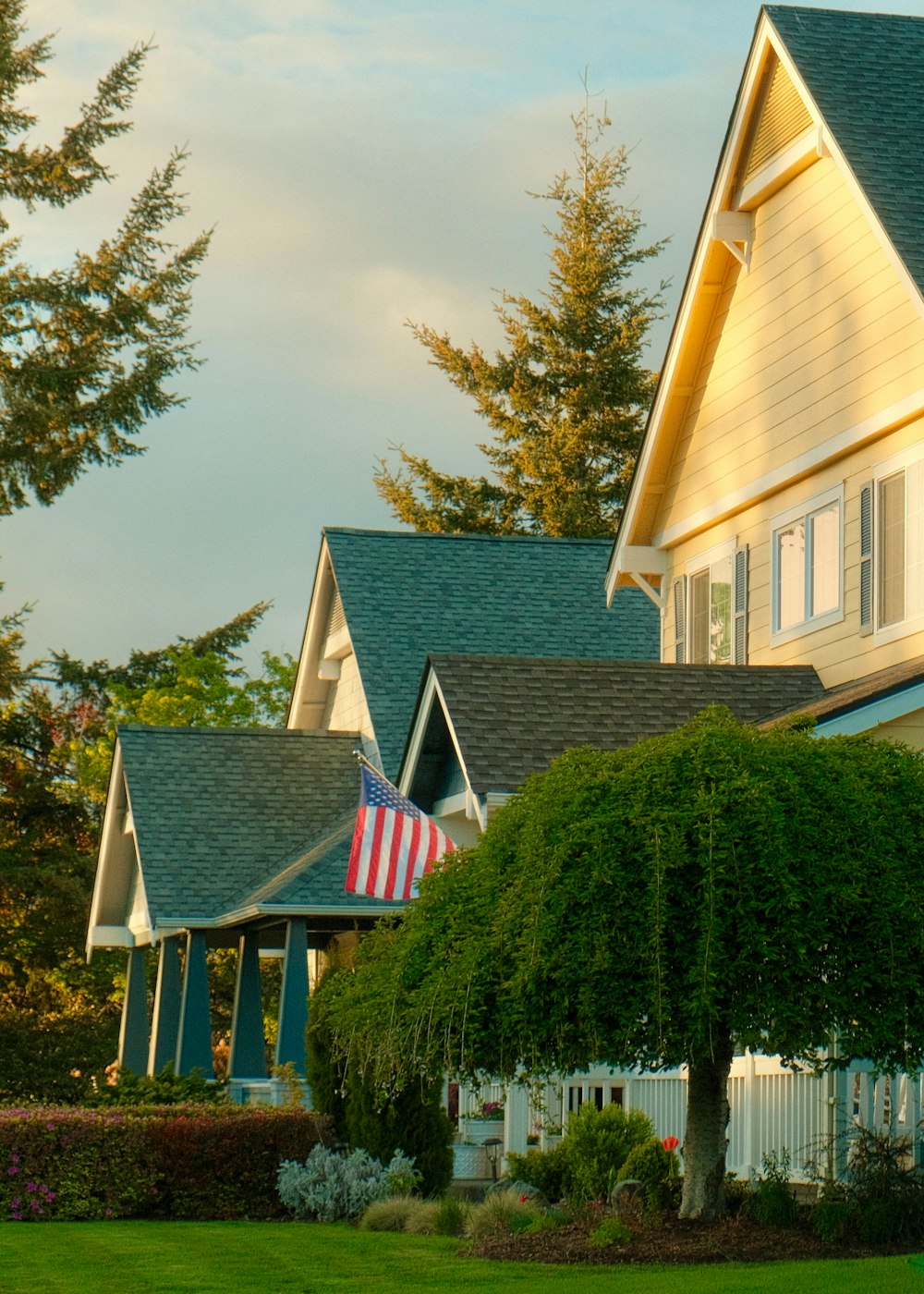 a row of houses with american flags on them