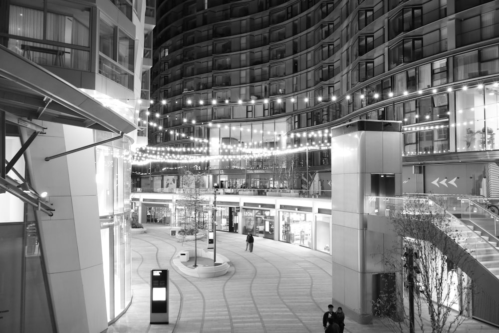 a black and white photo of a shopping mall
