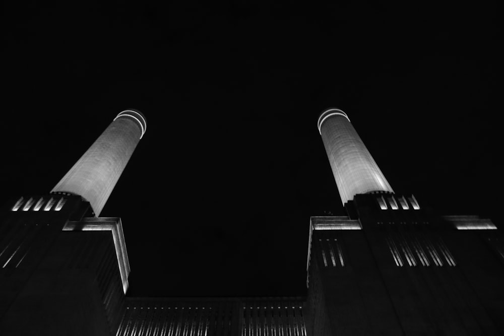 a black and white photo of two tall buildings