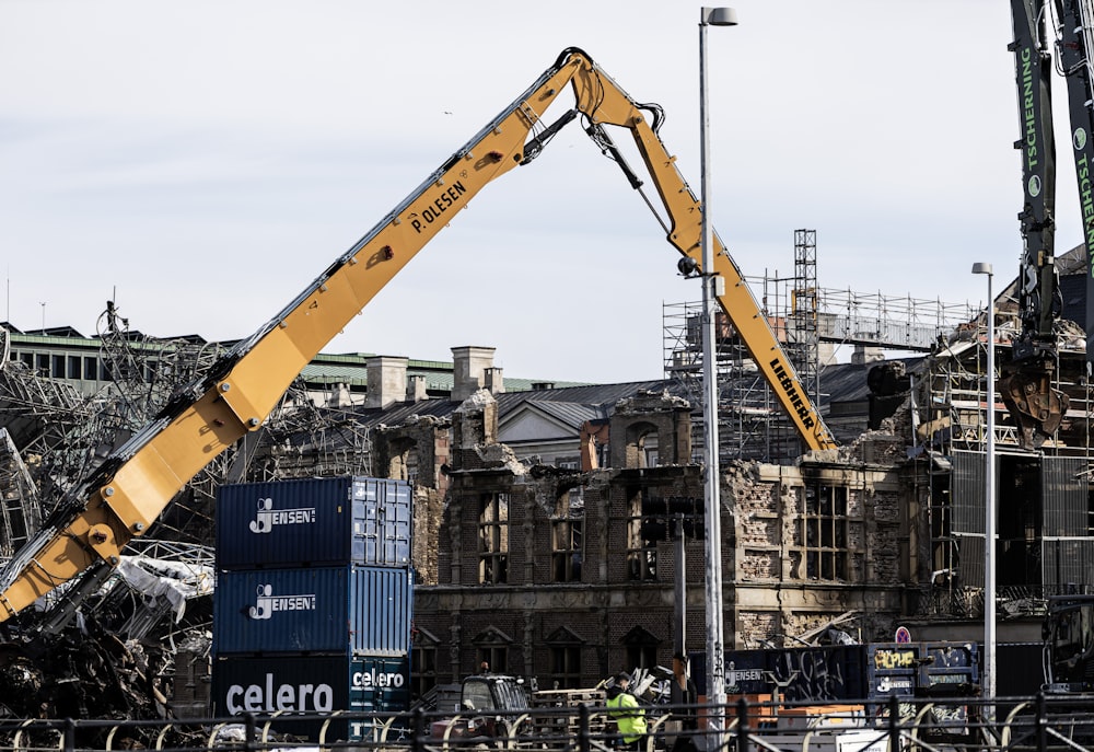 a crane is lifting a large piece of metal into the air