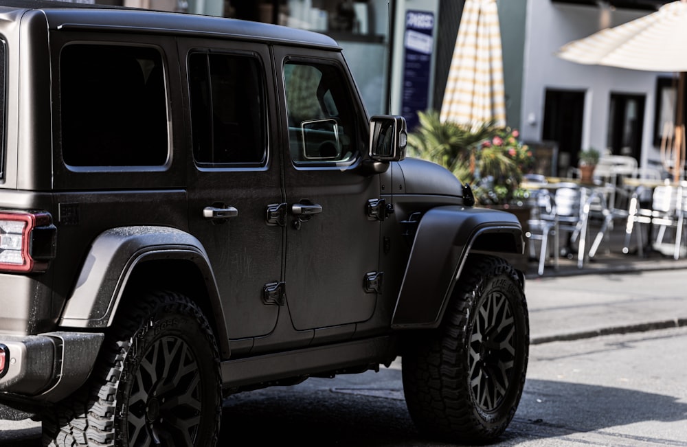 a black jeep parked on the side of the road