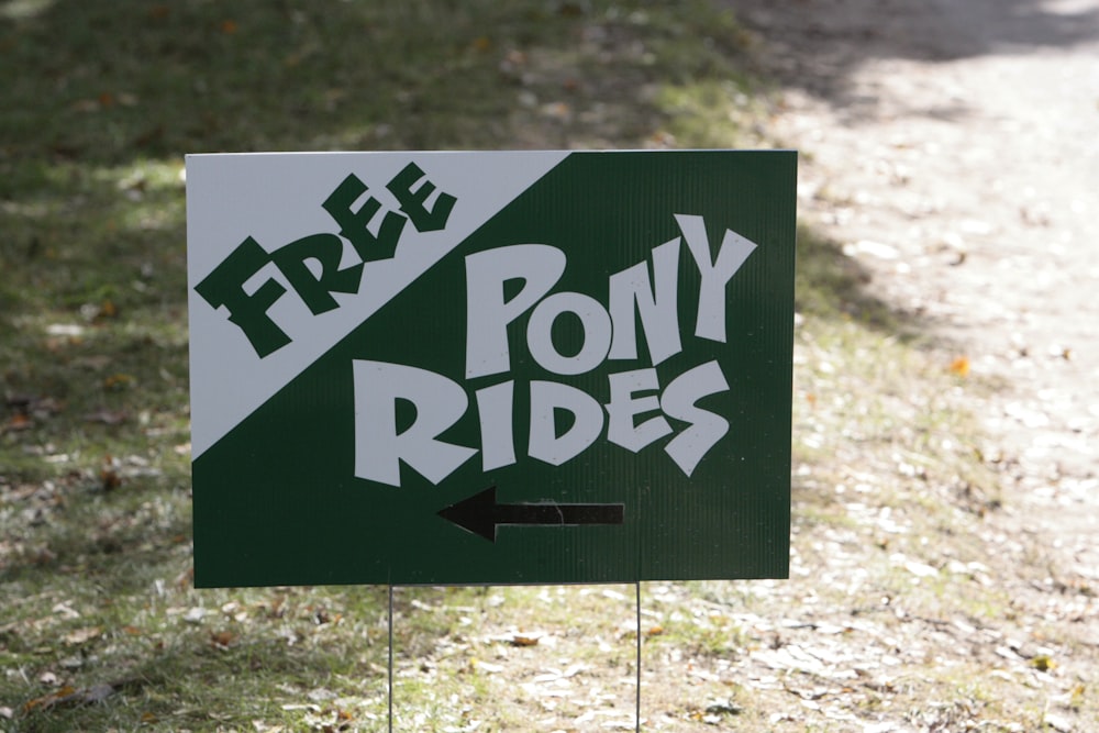 a sign that says free pony rides on it