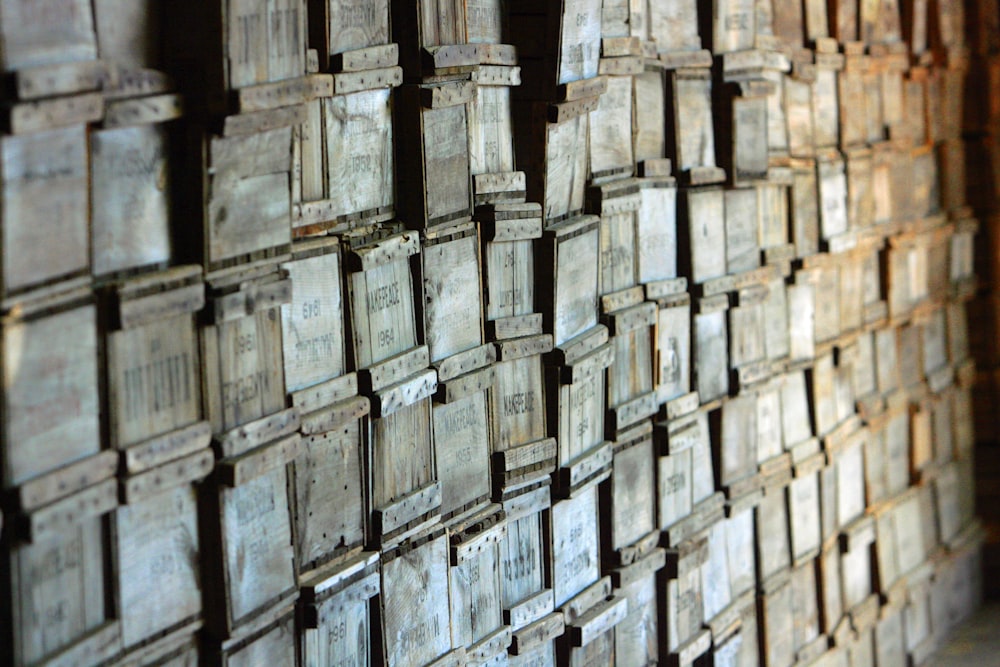 a bunch of wooden boxes stacked on top of each other