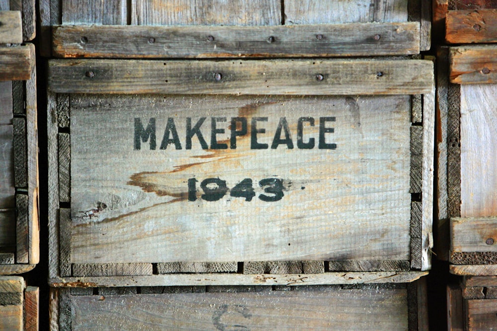 a close up of a wooden box with a sign on it