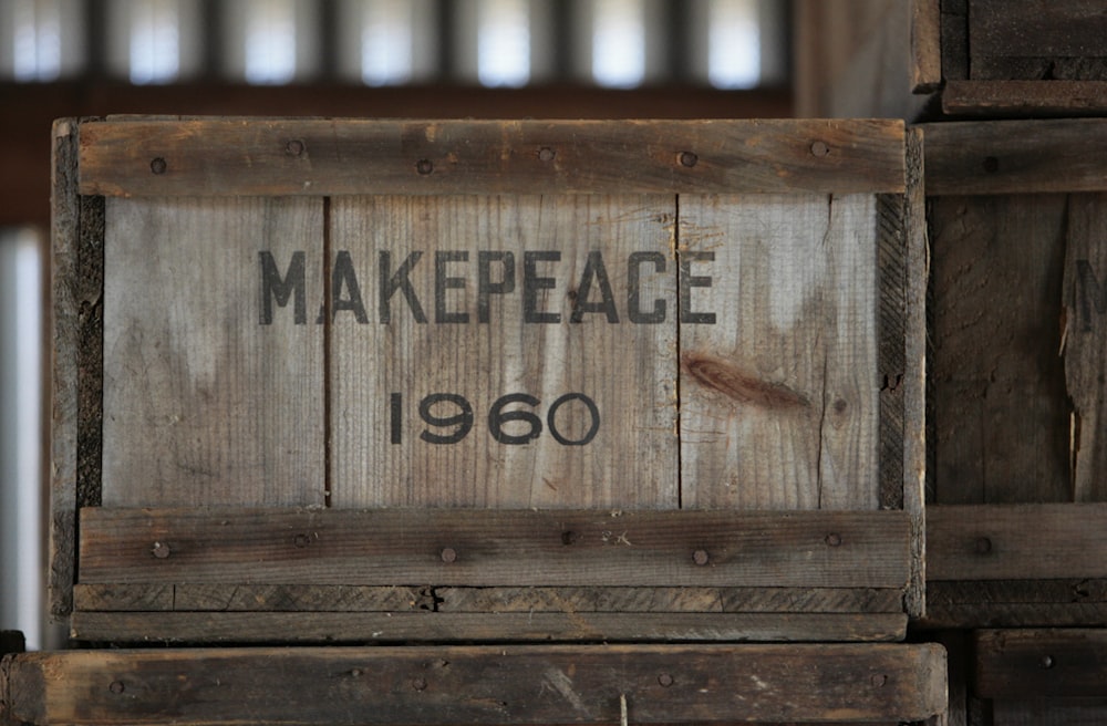 a close up of a wooden box with a sign on it