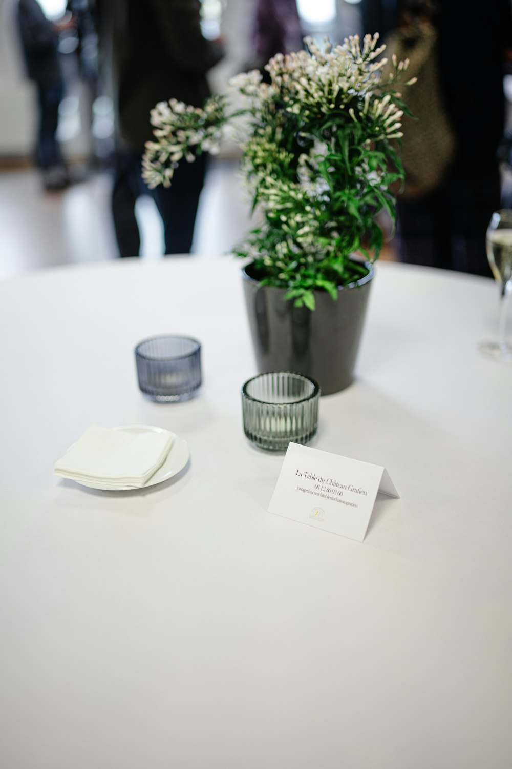 a table topped with a vase filled with flowers