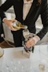 a woman pouring a glass of wine into a wine glass
