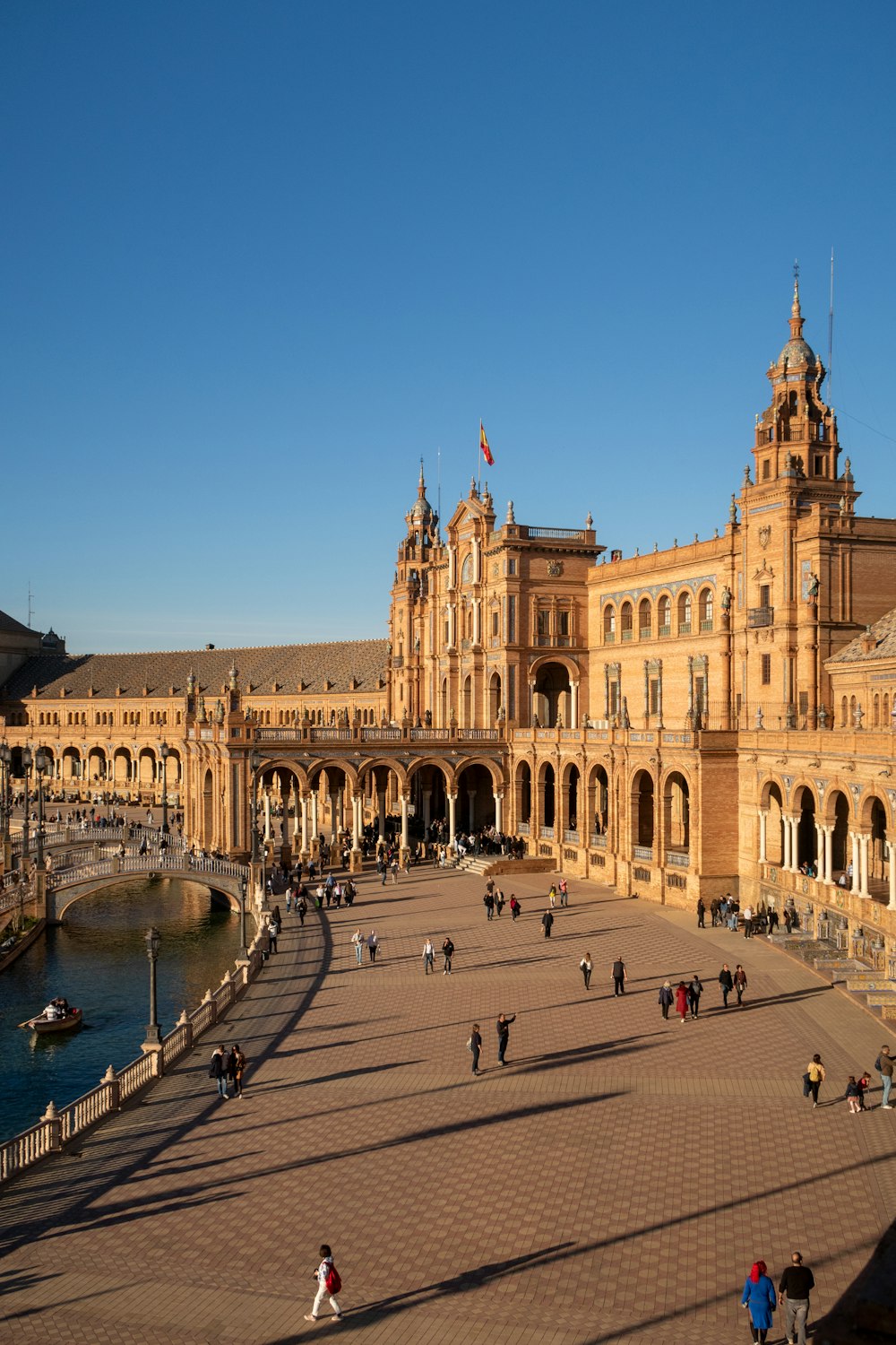 a large building with many people walking around it