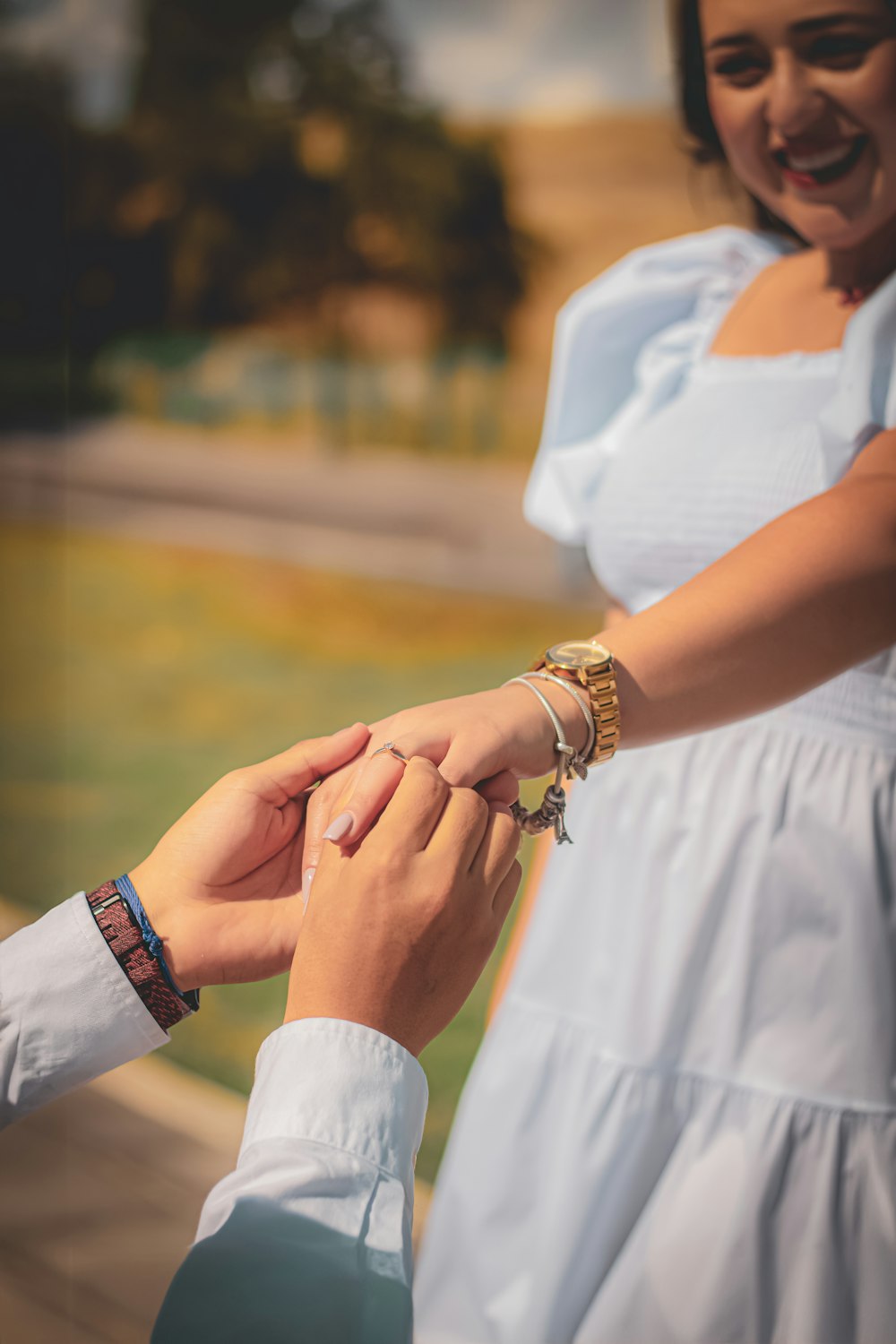 a man and a woman holding hands while standing next to each other