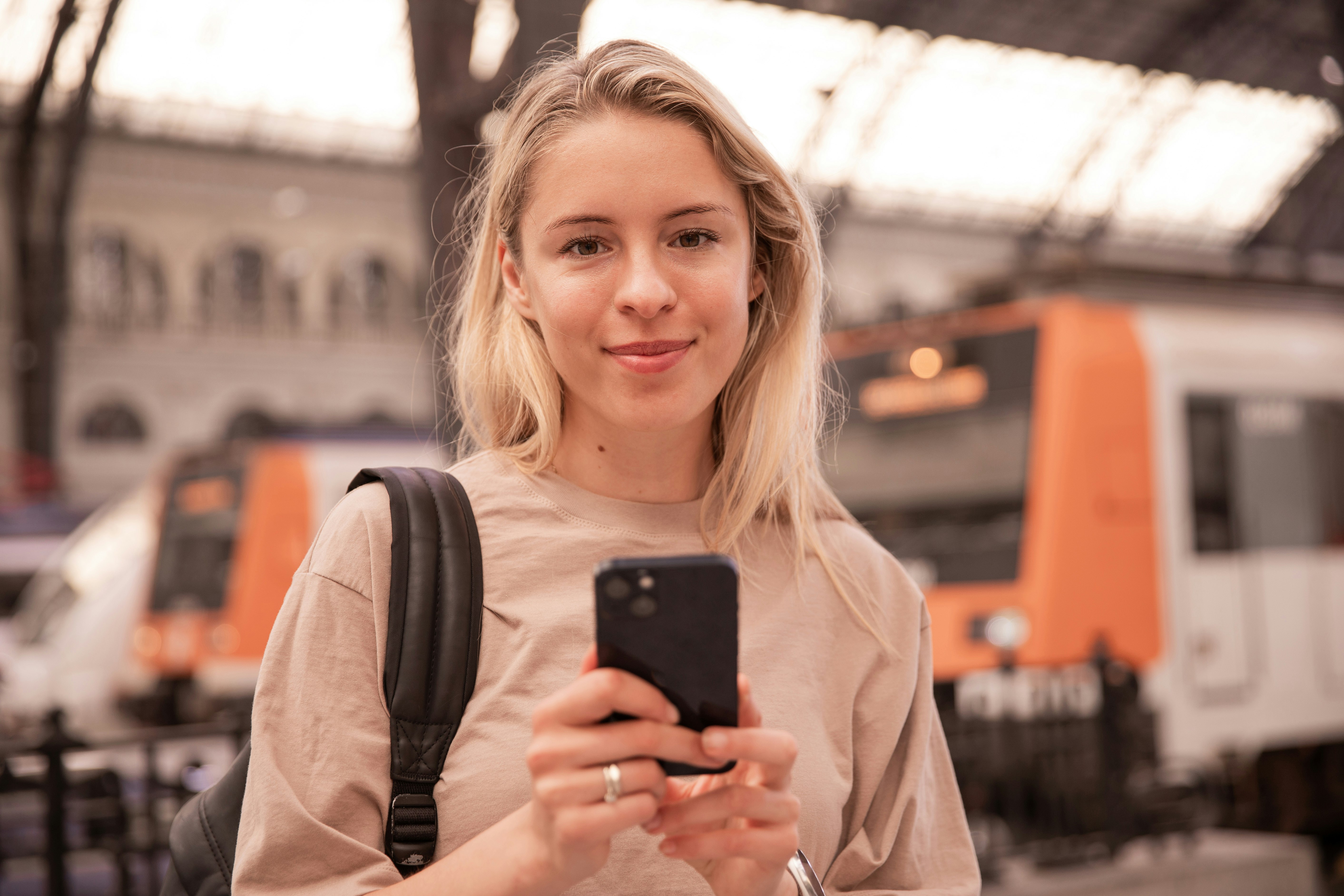 Hands holding a phone with a social media app open