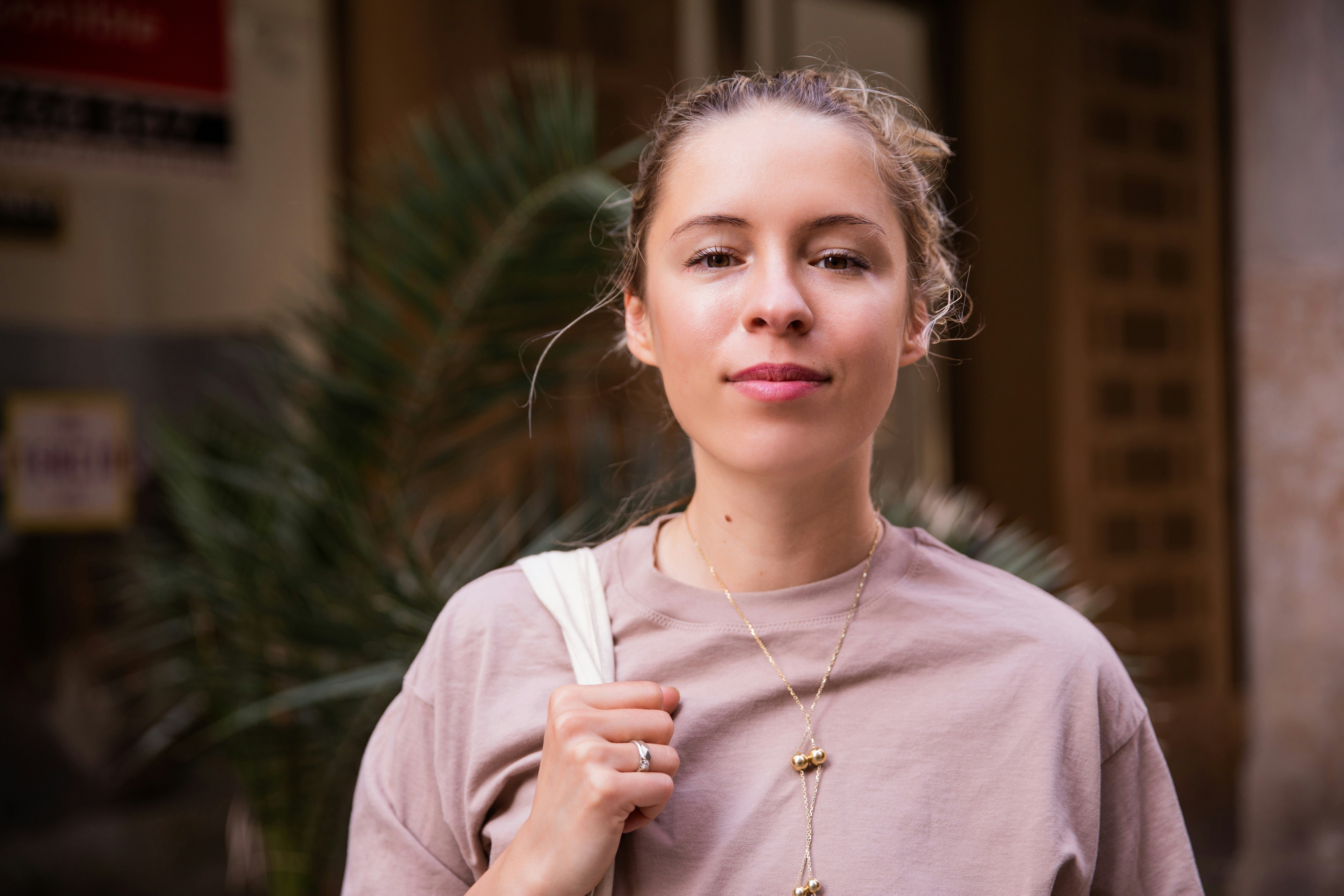 a woman holding a white object in her right hand