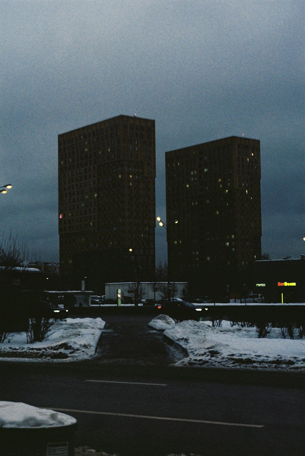 a couple of tall buildings sitting next to each other