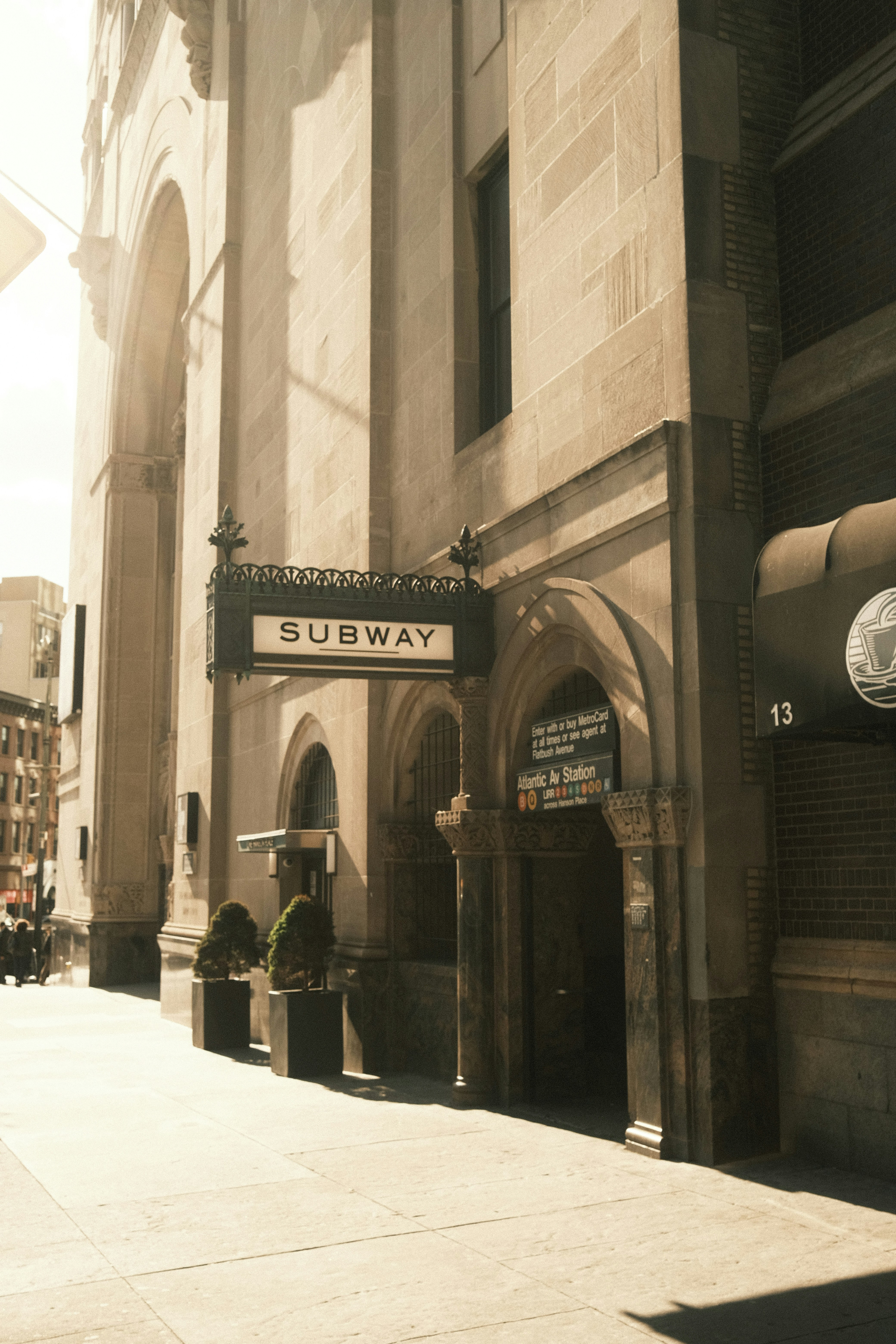 A building with a subway sign on the front of it photo – Free Road ...