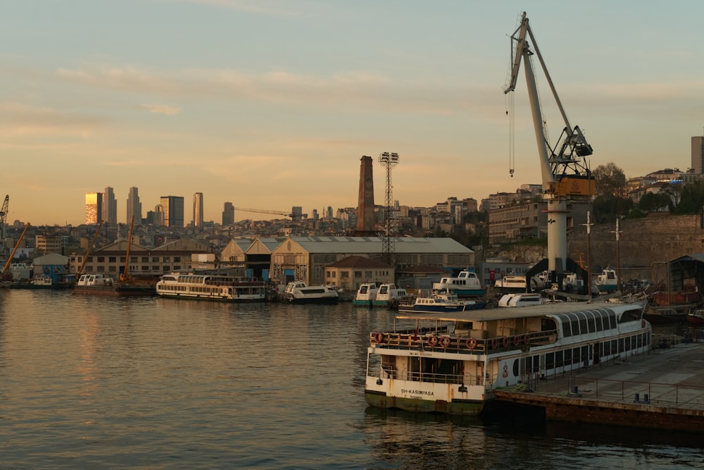 a boat is docked in a harbor with a city in the background