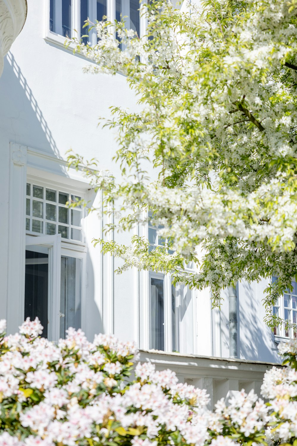 a white building with a clock on the front of it