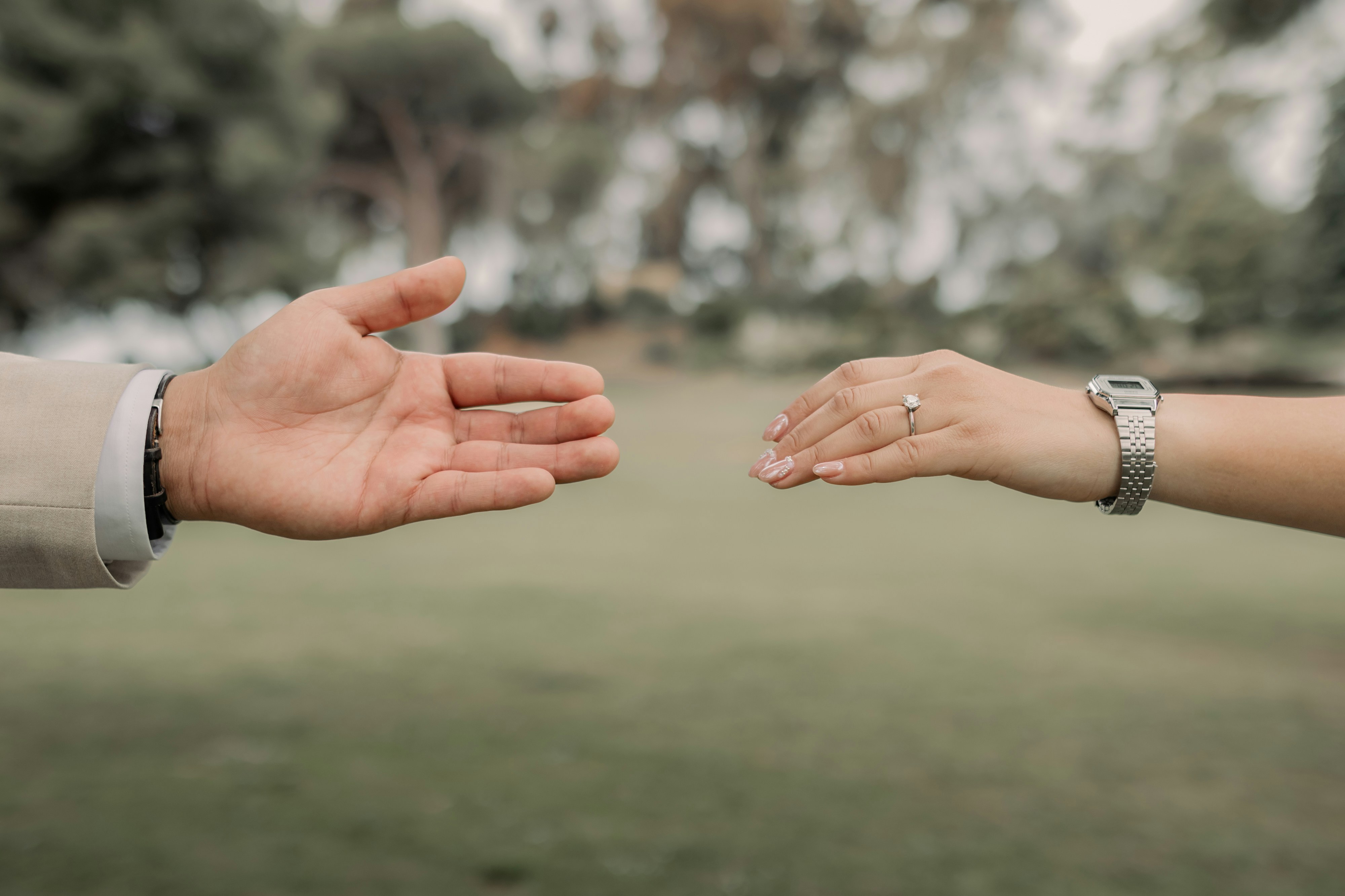 a close up of a person holding another person's hand