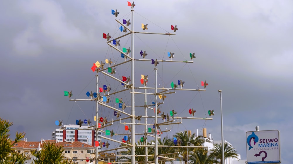 a pole with a bunch of colorful flags on top of it