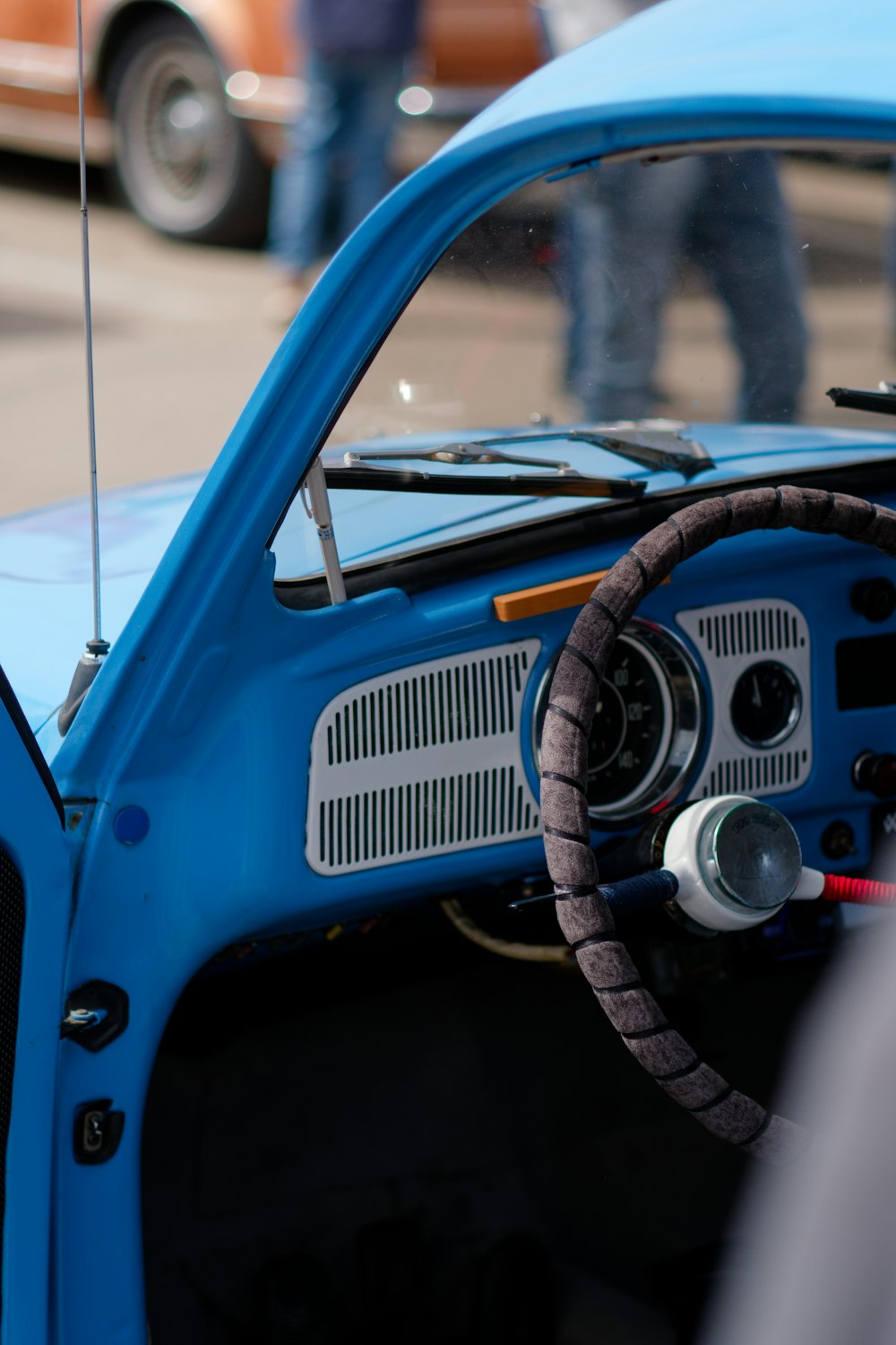 a blue car with a steering wheel and dashboard