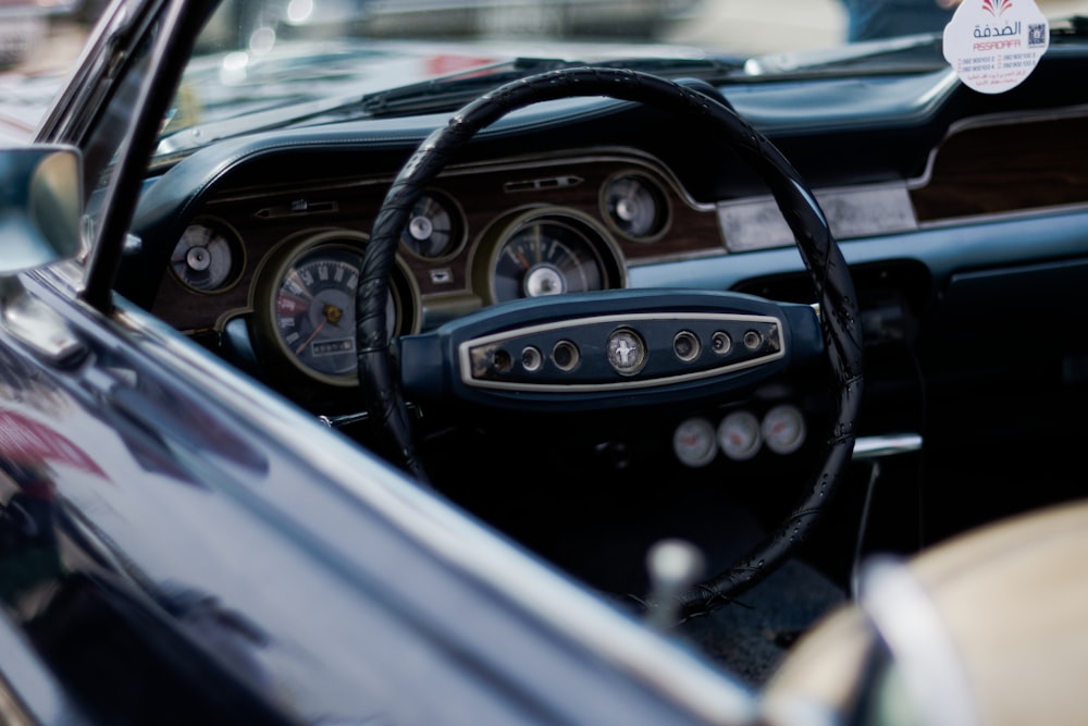 a close up of a steering wheel and dashboard of a car