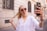 a woman taking a selfie with her cell phone