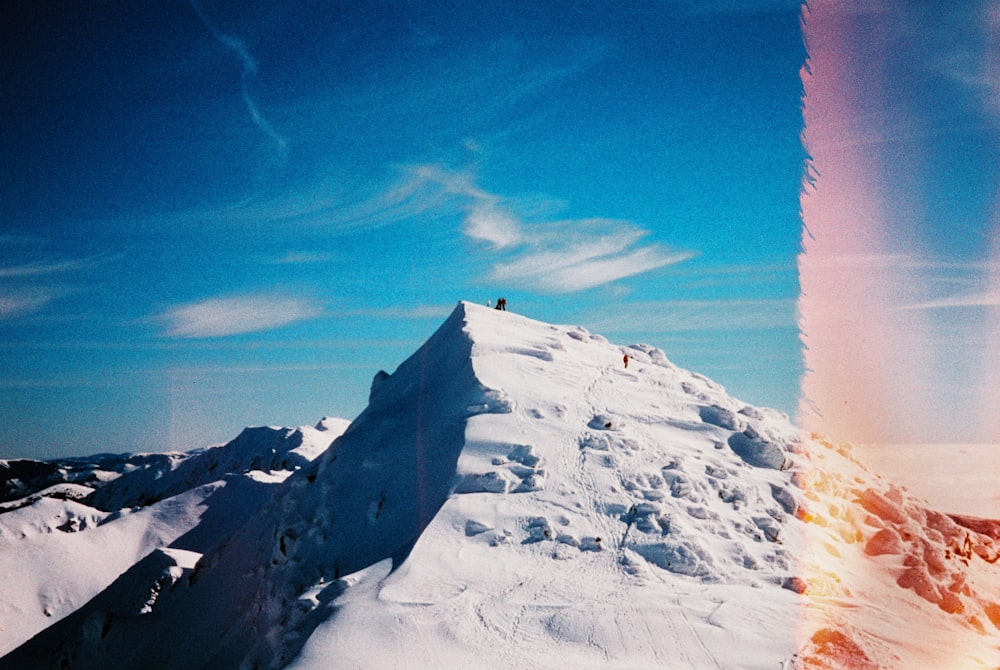 a person on a snowboard on a snowy mountain