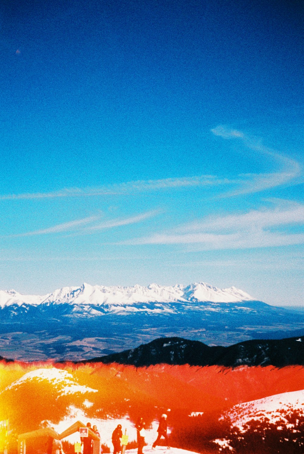 a man riding skis on top of a snow covered slope