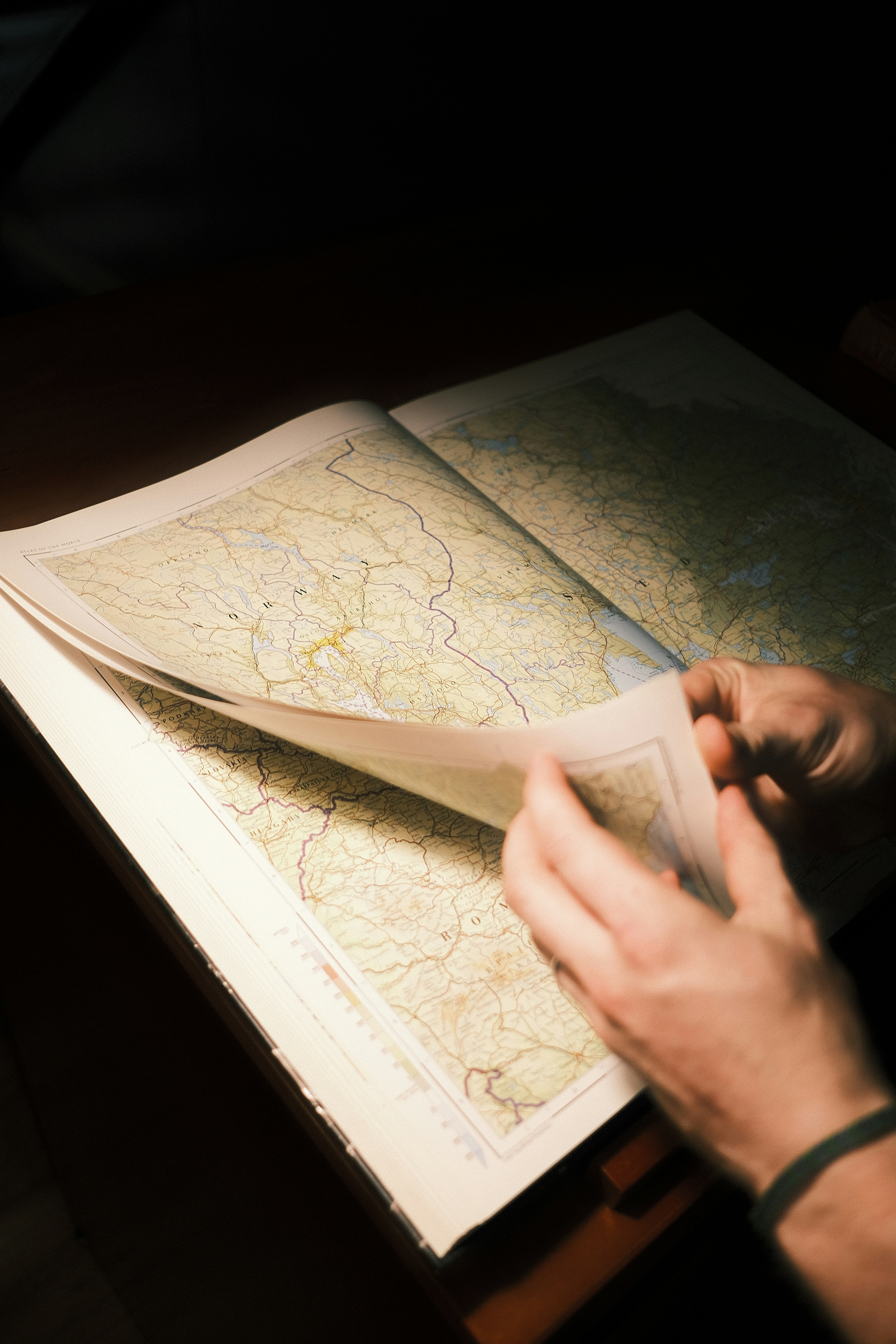 a person is looking at a map on a table