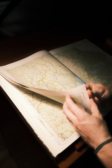 a person is looking at a map on a table