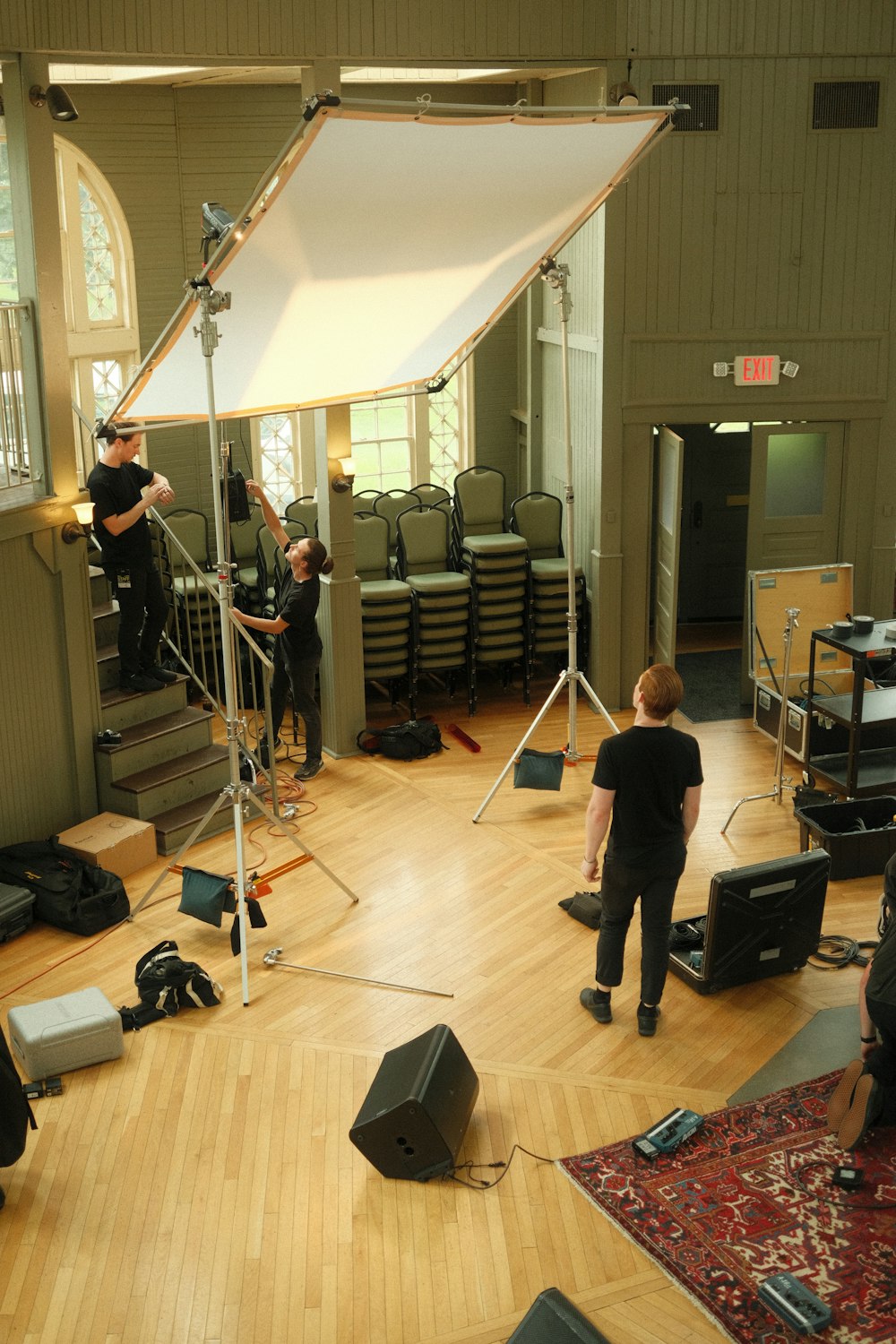 a group of people in a room with a camera