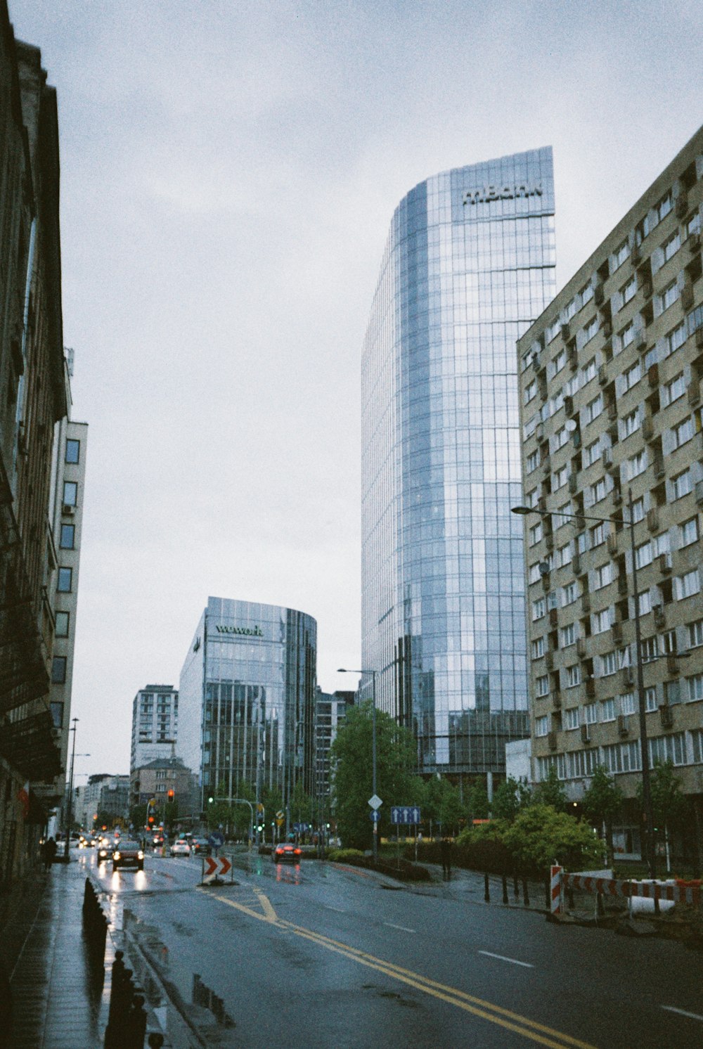 a city street filled with lots of tall buildings