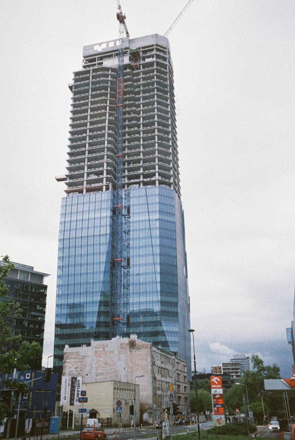 a tall building with a crane on top of it