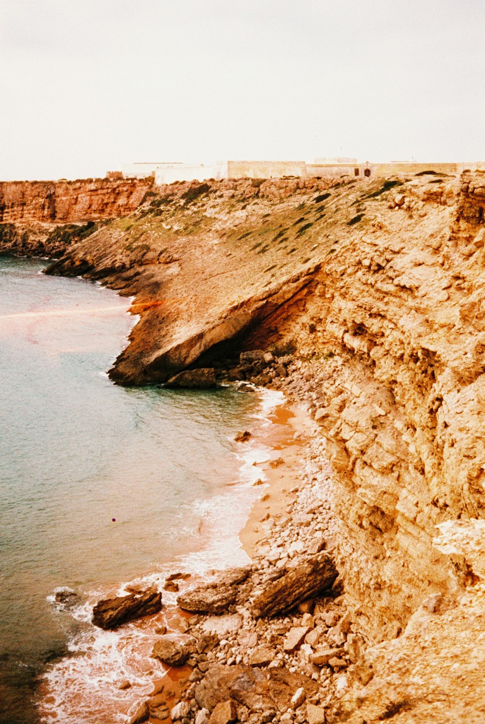 a view of a rocky beach and a body of water