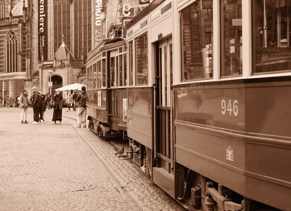 a black and white photo of a train on the tracks