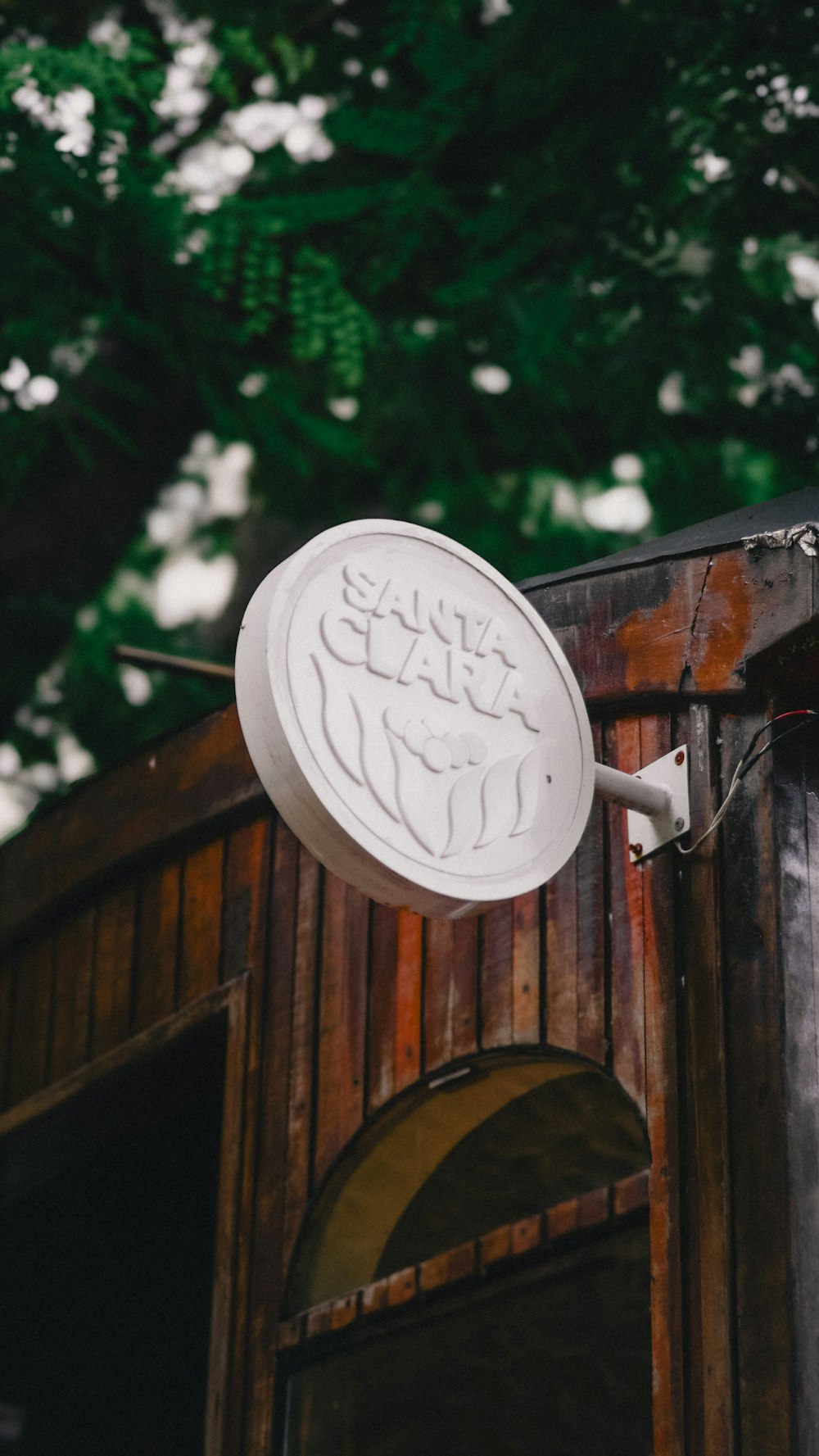 a satellite dish on top of a wooden building