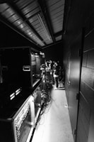 a black and white photo of a group of people in a room