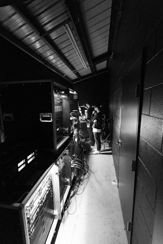 a black and white photo of a group of people in a room