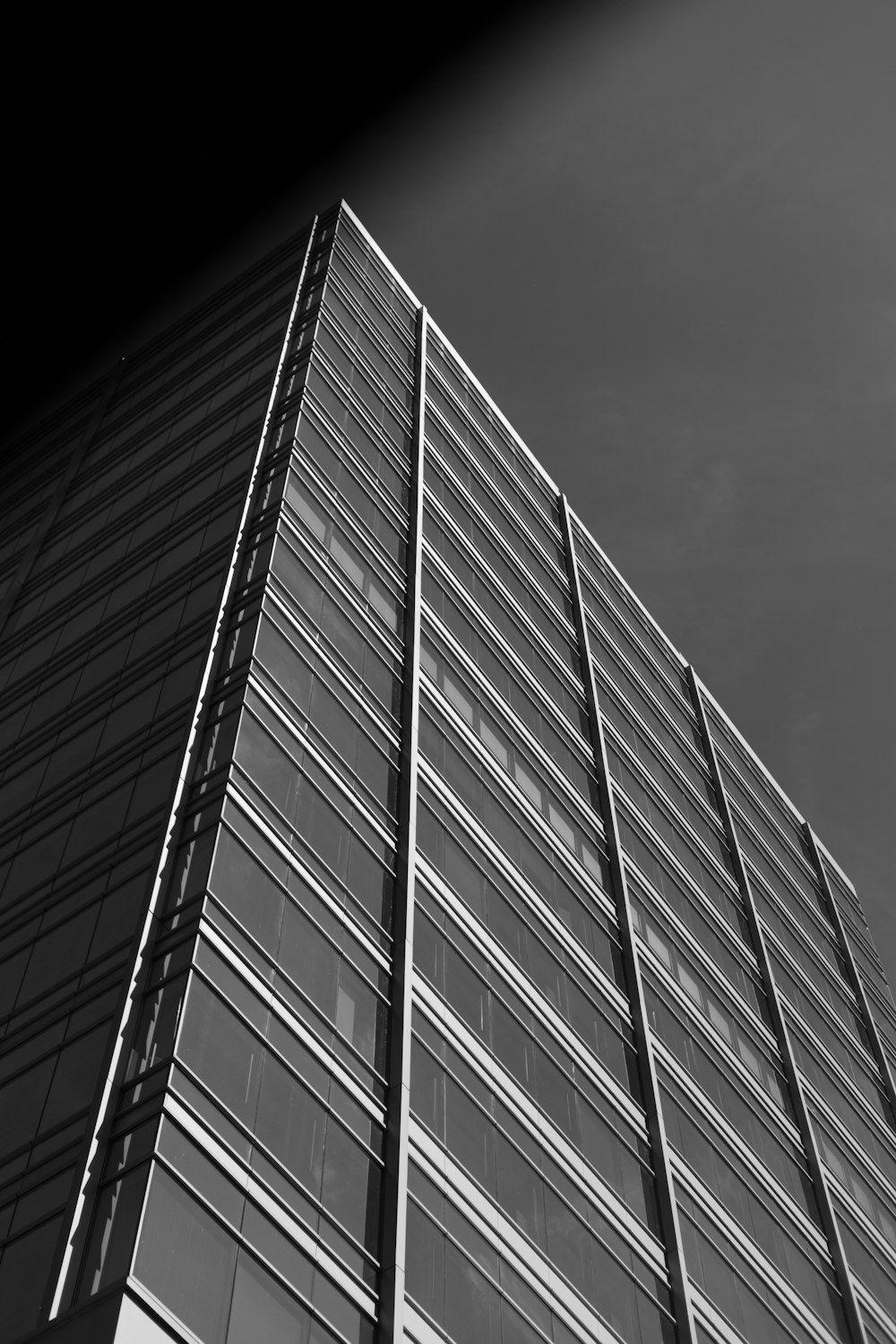 a black and white photo of a tall building