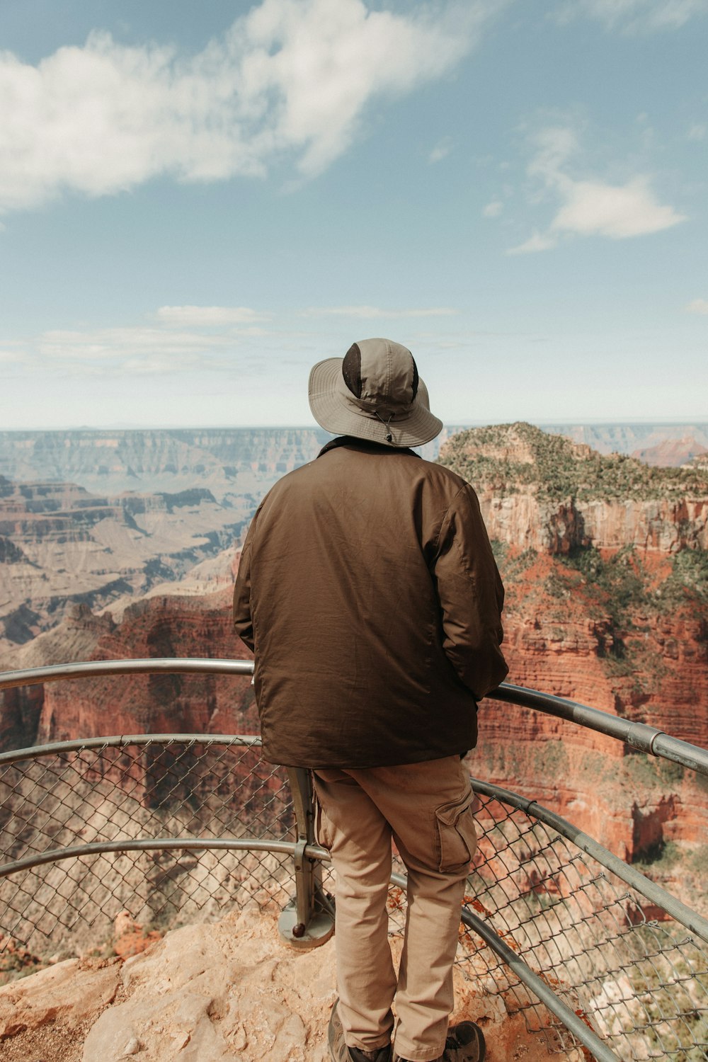 a man standing at the edge of a cliff