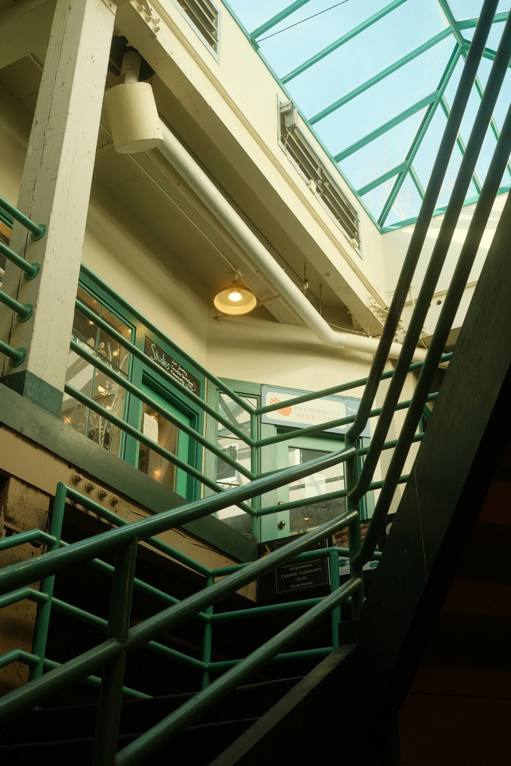 a stairwell leading up to a building with a skylight