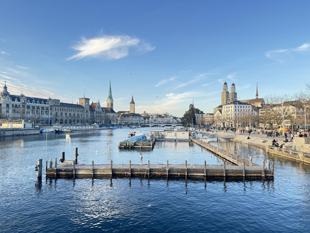 a body of water with a dock in the middle of it