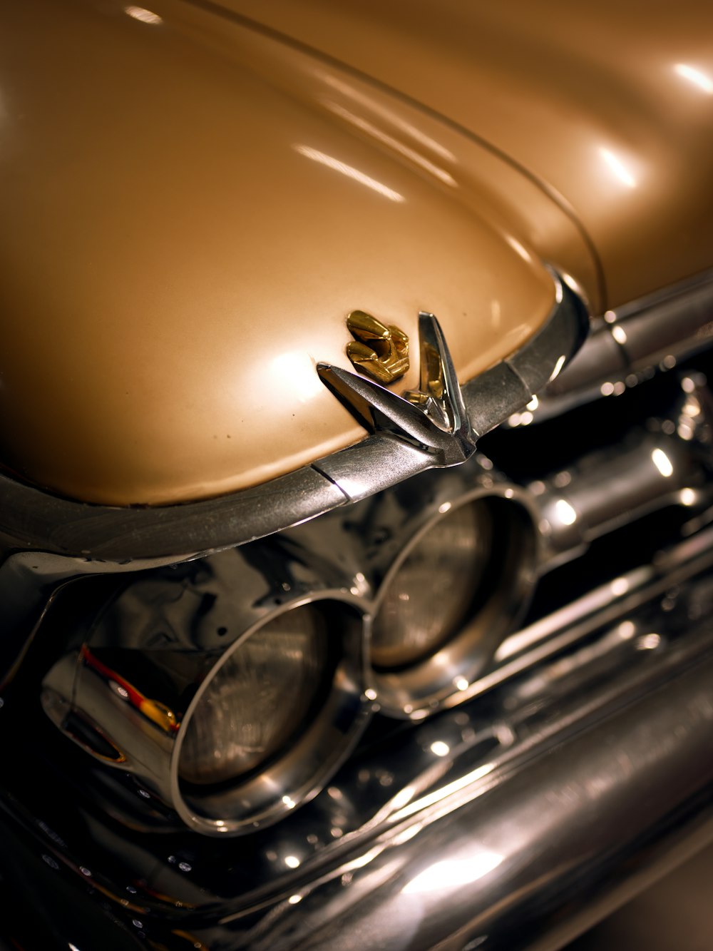 a close up of a shiny gold car engine