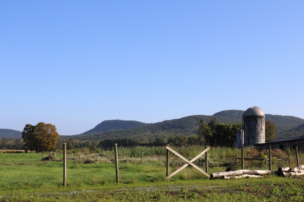 a farm with mountains in the background