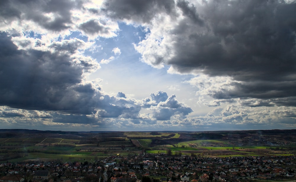 a view of a city under a cloudy sky