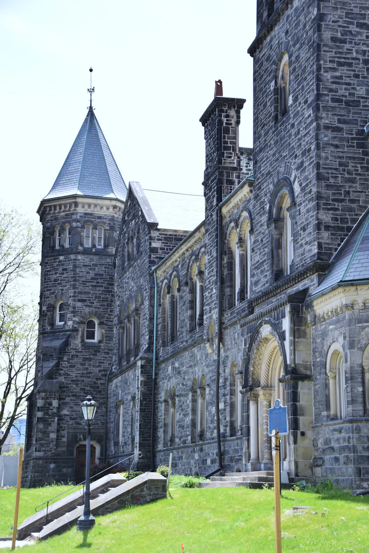 University of Toronto clock tower — Canada PAL exemption for master's and PhD at public universities