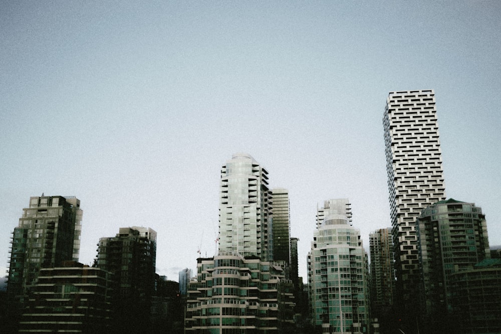 a group of tall buildings sitting next to each other